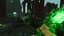 Large boss enemy with green glow in ancient ruined structure