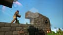 Player in armor placing stone blocks on floating island